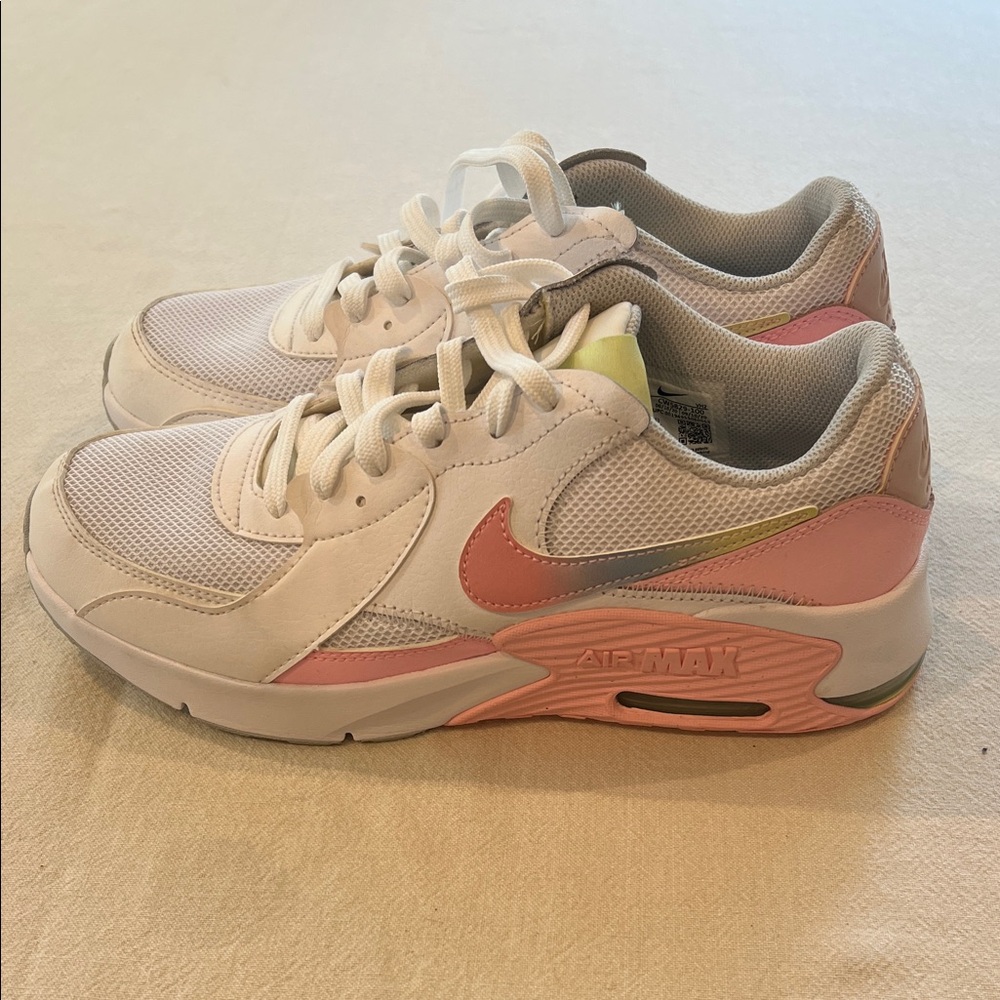 Nike Air Max white sneakers with pink accents